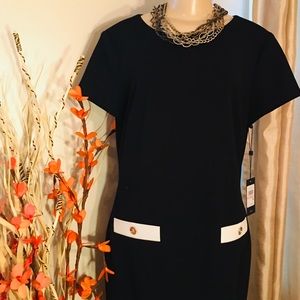 Stylishly simple black dress with white accents